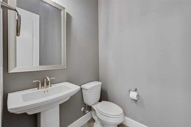 4600 Paintbrush Way, Aubrey, TX 76227 - half bath featuring toilet, baseboards, and a sink