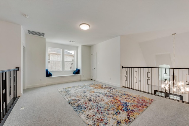 4600 Paintbrush Way, Aubrey, TX 76227 - carpeted empty room featuring visible vents, baseboards, and a notable chandelier
