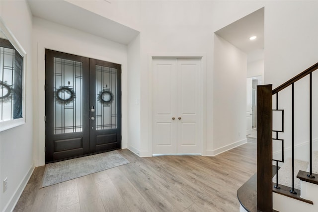 4600 Paintbrush Way, Aubrey, TX 76227 - entrance foyer with wood finished floors, stairs, french doors, baseboards, and recessed lighting