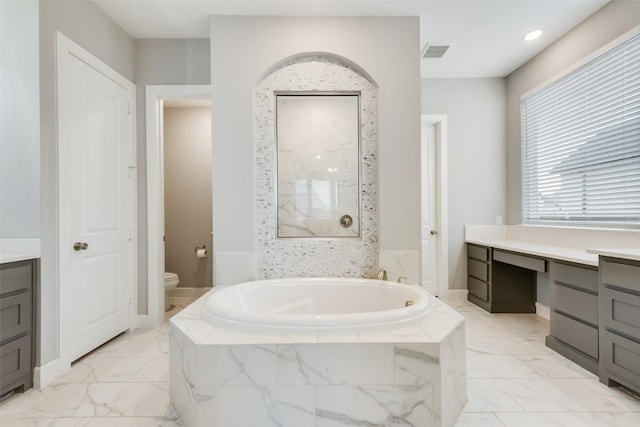 4600 Paintbrush Way, Aubrey, TX 76227 - bathroom with marble finish floor, visible vents, toilet, vanity, and a garden tub