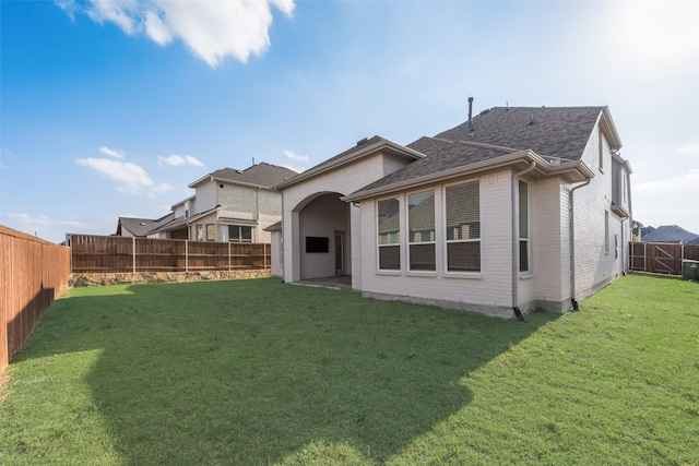 4600 Paintbrush Way, Aubrey, TX 76227 - back of house with brick siding, a lawn, a shingled roof, and a fenced backyard