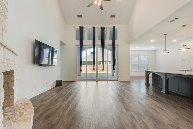4600 Paintbrush Way, Aubrey, TX 76227 - unfurnished living room with dark wood-type flooring, visible vents, a ceiling fan, and high vaulted ceiling