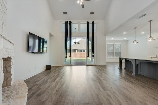 4600 Paintbrush Way, Aubrey, TX 76227 - unfurnished living room with high vaulted ceiling, ceiling fan, wood finished floors, and visible vents