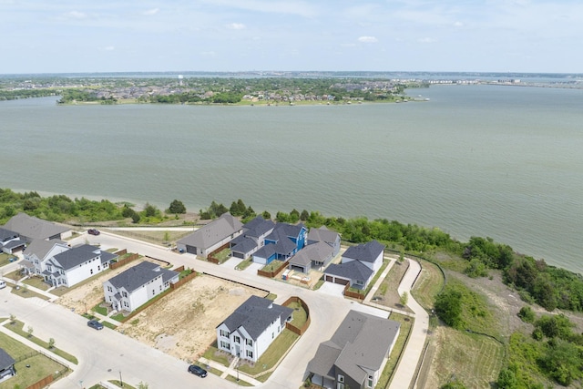 aerial view featuring a residential view and a water view