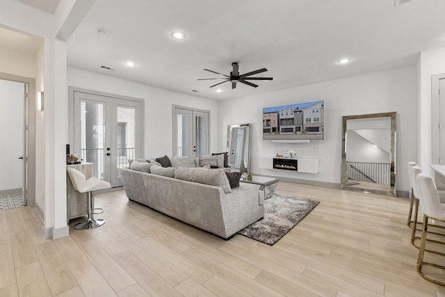 2635 Carmelita St, Dallas, TX 75212 - living room featuring french doors, ceiling fan, light wood-style flooring, and recessed lighting