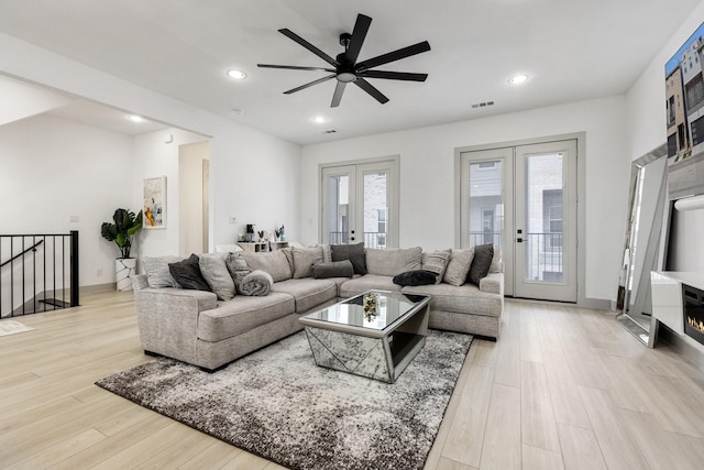 2635 Carmelita St, Dallas, TX 75212 - living room featuring french doors, light wood-style floors, a ceiling fan, and recessed lighting