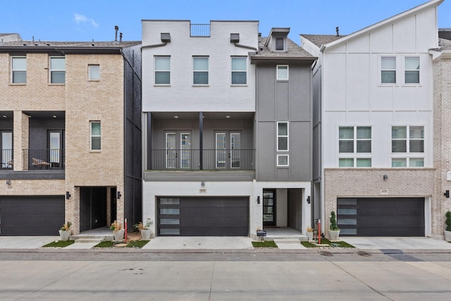2635 Carmelita St, Dallas, TX 75212 - townhome / multi-family property with an attached garage and brick siding