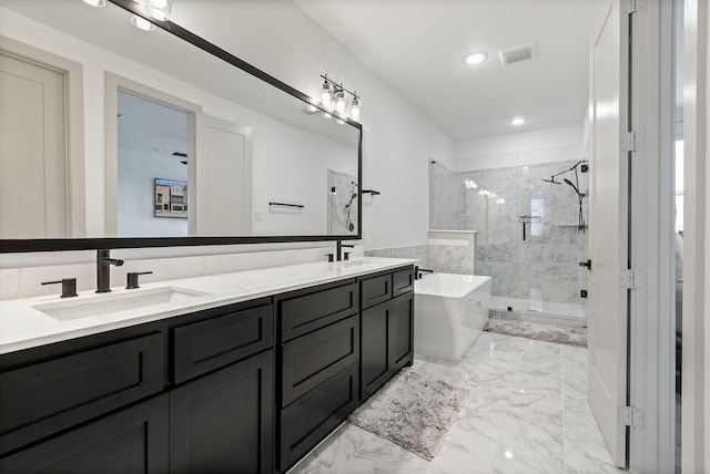 2635 Carmelita St, Dallas, TX 75212 - full bath with marble finish floors, a marble finish shower, double vanity, a freestanding bath, and recessed lighting