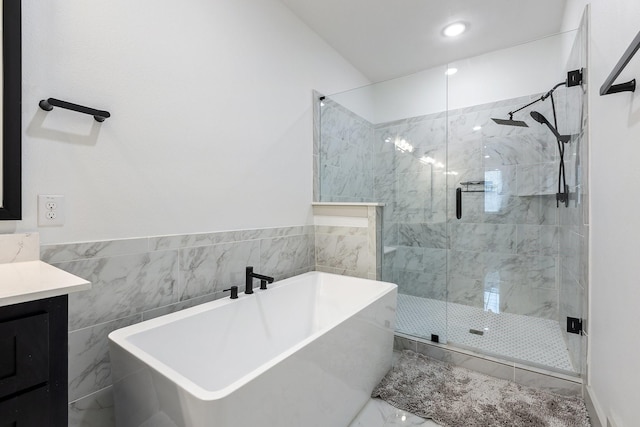 2635 Carmelita St, Dallas, TX 75212 - full bath with a soaking tub, a shower stall, vanity, marble finish flooring, and recessed lighting