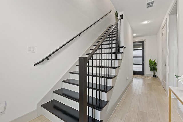 2635 Carmelita St, Dallas, TX 75212 - stairway featuring wood finished floors and recessed lighting