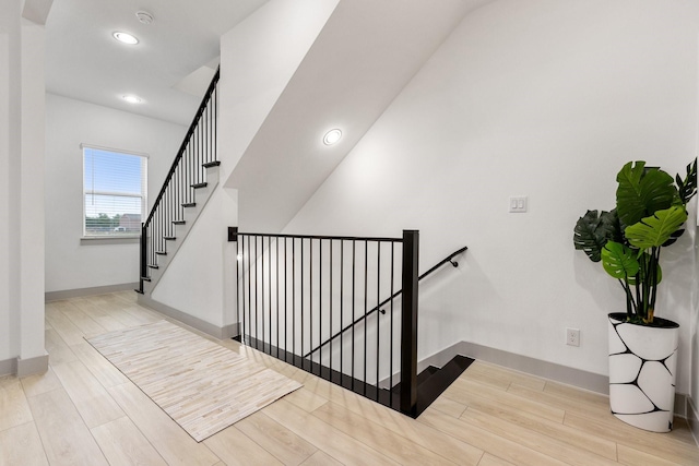 2635 Carmelita St, Dallas, TX 75212 - stairway with wood finished floors, recessed lighting, and arched walkways