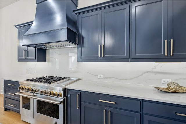 4120 Ridgecrest Dr, Flower Mound, TX 75022 - kitchen featuring blue cabinets, decorative backsplash, custom exhaust hood, and double oven range