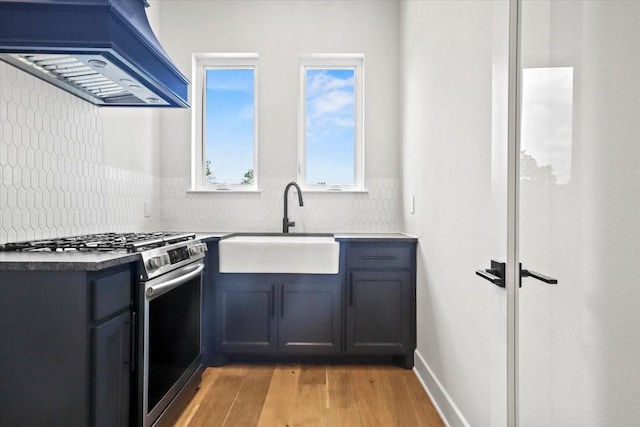 4120 Ridgecrest Dr, Flower Mound, TX 75022 - kitchen featuring gas stove, a sink, custom range hood, and tasteful backsplash