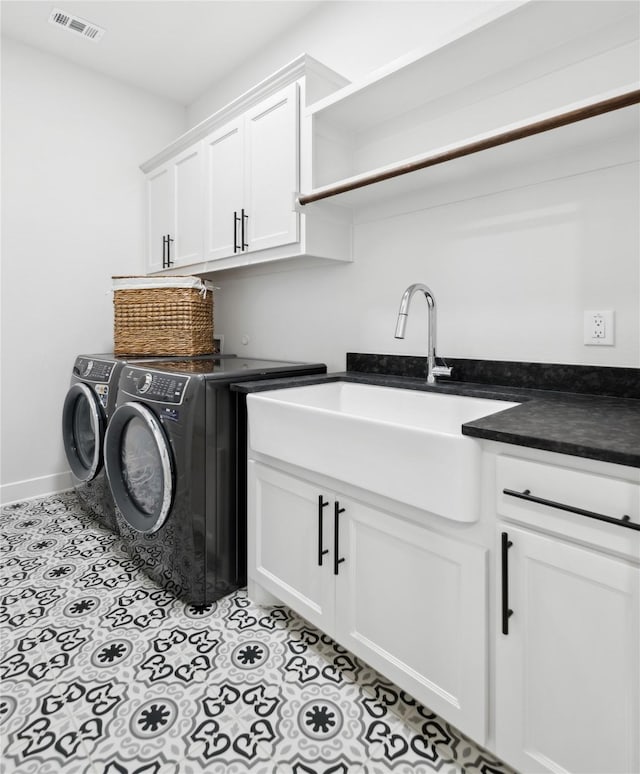 4120 Ridgecrest Dr, Flower Mound, TX 75022 - laundry area featuring a sink, light tile patterned floors, cabinet space, visible vents, and independent washer and dryer