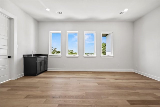 4120 Ridgecrest Dr, Flower Mound, TX 75022 - unfurnished room featuring recessed lighting, light wood-type flooring, visible vents, and a sink