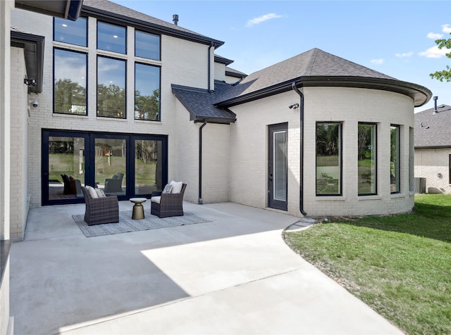 4120 Ridgecrest Dr, Flower Mound, TX 75022 - back of house with cooling unit, roof with shingles, a patio area, and brick siding