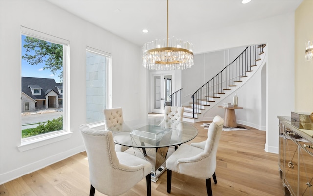 4120 Ridgecrest Dr, Flower Mound, TX 75022 - dining area with baseboards, light wood-type flooring, stairs, and an inviting chandelier