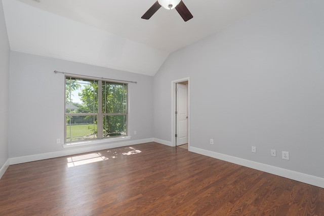 unfurnished room featuring lofted ceiling, wood finished floors, a ceiling fan, and baseboards