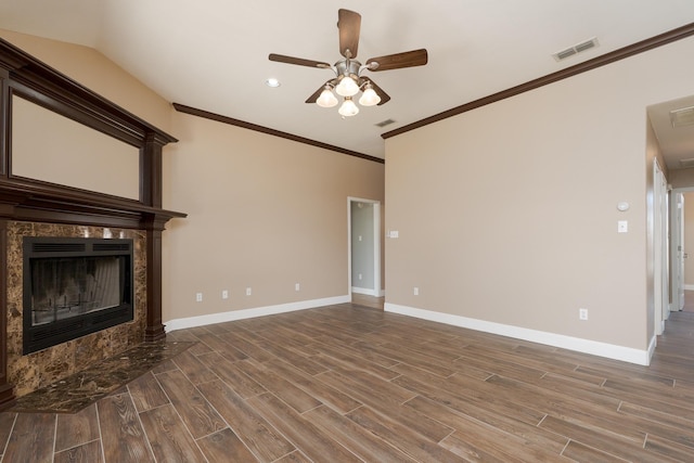 unfurnished living room featuring wood finished floors, visible vents, crown molding, and ceiling fan