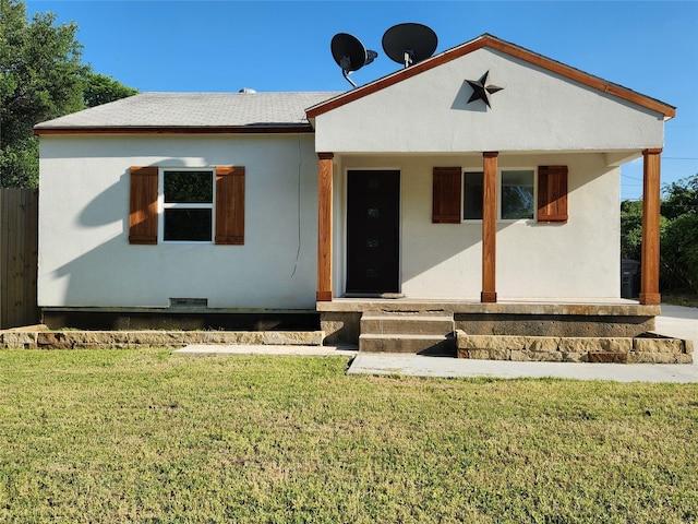 3123 Kellogg Ave, Dallas, TX 75216 - bungalow-style house with a porch, a front lawn, fence, and stucco siding