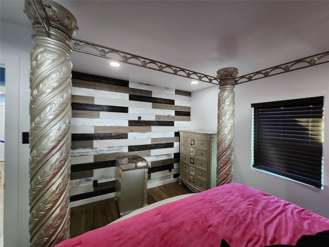 3123 Kellogg Ave, Dallas, TX 75216 - bedroom with recessed lighting, wooden walls, wood finished floors, and decorative columns