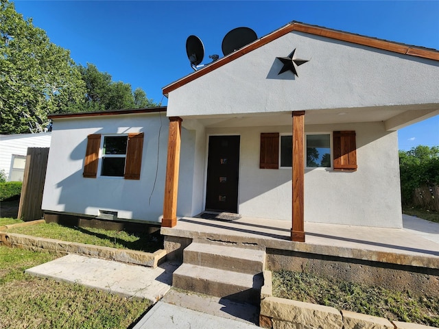 3123 Kellogg Ave, Dallas, TX 75216 - bungalow-style house with a porch and stucco siding