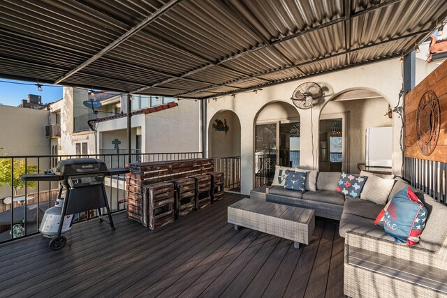 deck featuring a grill and an outdoor hangout area