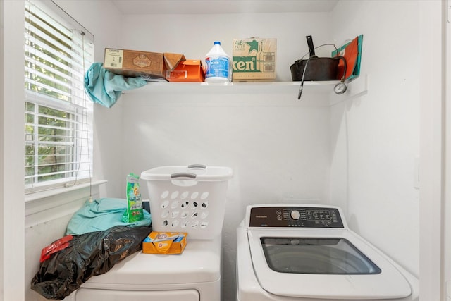 laundry room featuring washing machine and dryer and laundry area
