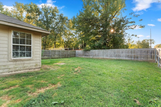 view of yard with a fenced backyard