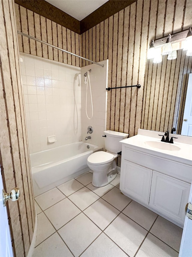 full bath with shower / bathtub combination, tile patterned flooring, vanity, and toilet