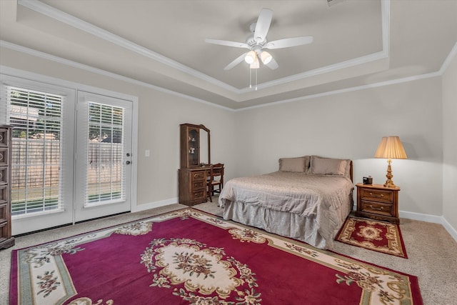 carpeted bedroom with crown molding, baseboards, access to outside, and a tray ceiling