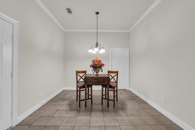 dining space featuring baseboards, visible vents, a notable chandelier, and ornamental molding