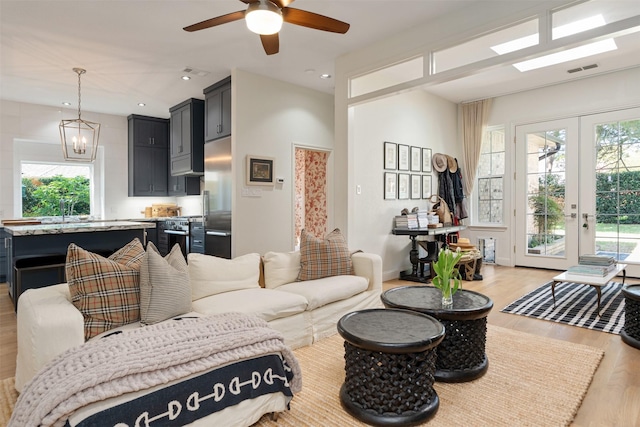 1747 Crescent Ln, Duncanville, TX 75137 - living room with light wood-style flooring, a ceiling fan, french doors, and recessed lighting
