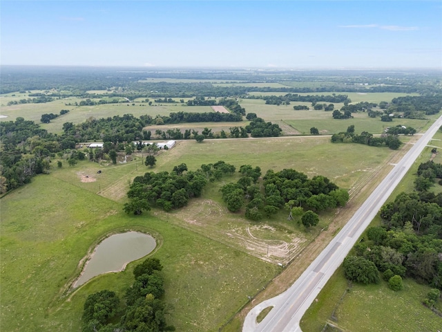 aerial view with a water view and a rural view