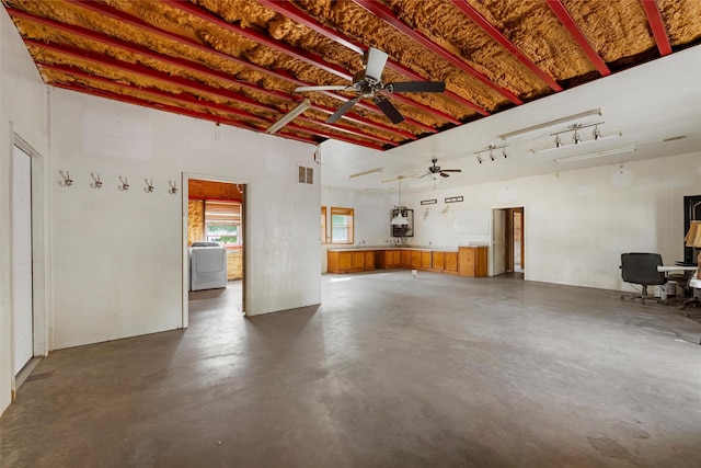interior space with a ceiling fan and visible vents