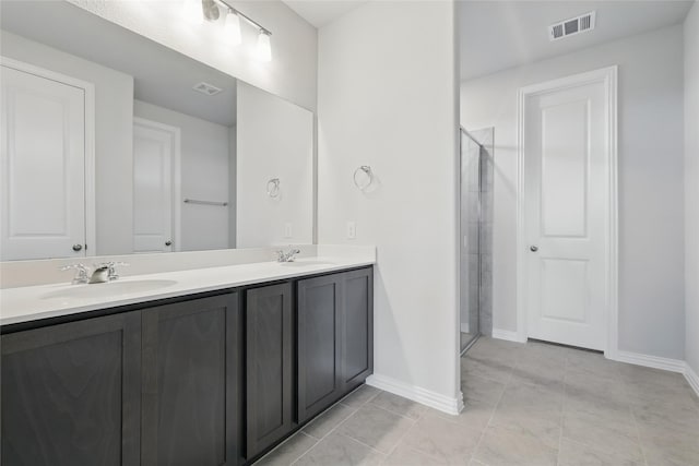 817 Hadley Dr, Princeton, TX 75071 - bathroom with double vanity, a shower stall, and tile patterned floors
