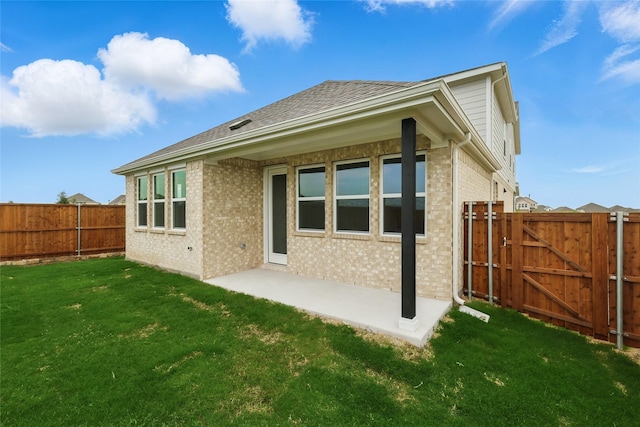 817 Hadley Dr, Princeton, TX 75071 - back of house featuring a fenced backyard, brick siding, a gate, and a patio