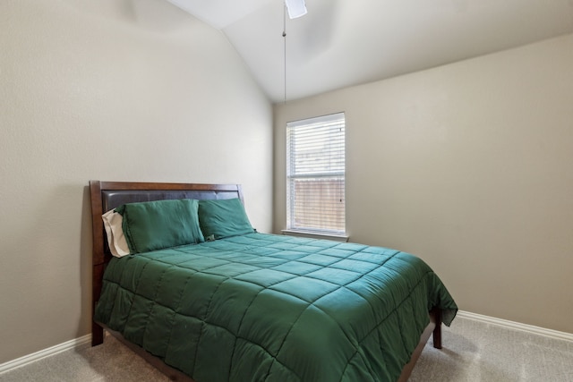 carpeted bedroom featuring ceiling fan, baseboards, and lofted ceiling