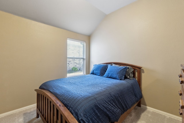 bedroom featuring carpet floors, vaulted ceiling, and baseboards