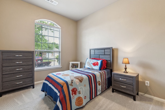 bedroom with light carpet, baseboards, and visible vents
