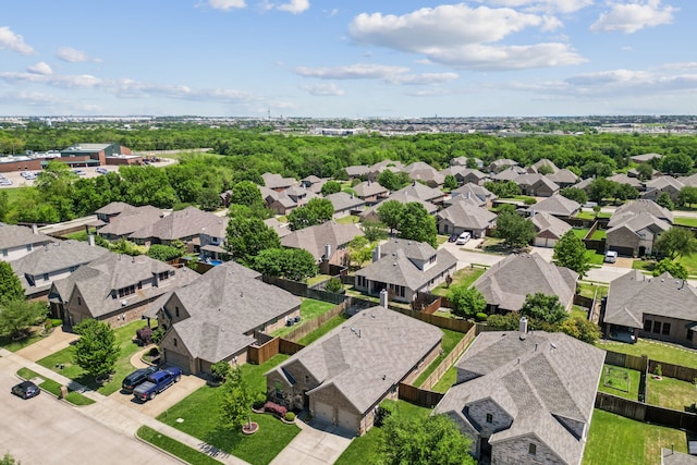 birds eye view of property with a residential view