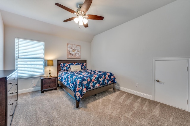 bedroom featuring vaulted ceiling, baseboards, carpet floors, and ceiling fan