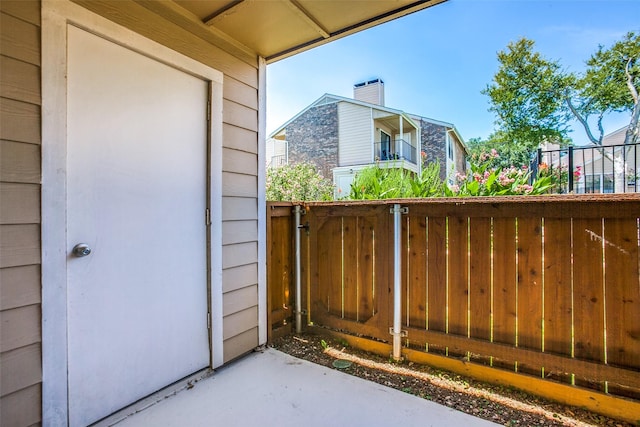 view of gate with fence