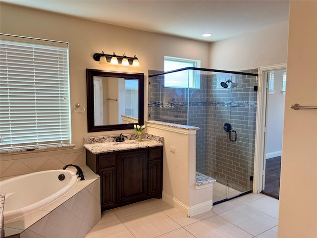 1005 Walford Dr, Forney, TX 75126 - full bathroom featuring vanity, a stall shower, a garden tub, and tile patterned floors