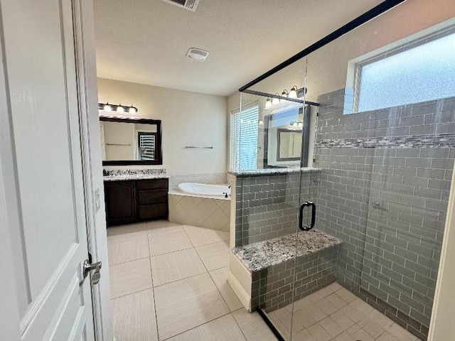 1005 Walford Dr, Forney, TX 75126 - bathroom featuring healthy amount of natural light, a bath, tile patterned flooring, and vanity