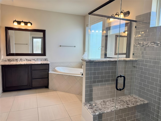 1005 Walford Dr, Forney, TX 75126 - bathroom featuring a stall shower, a garden tub, vanity, and tile patterned flooring