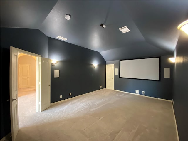 1005 Walford Dr, Forney, TX 75126 - carpeted cinema featuring vaulted ceiling and baseboards