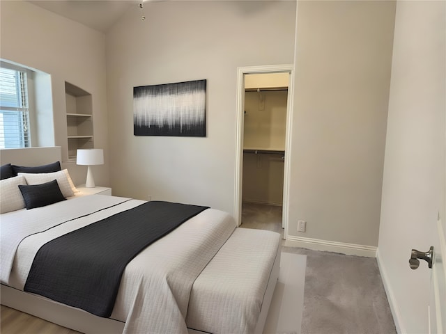 1005 Walford Dr, Forney, TX 75126 - bedroom with a walk in closet, baseboards, a closet, and light carpet
