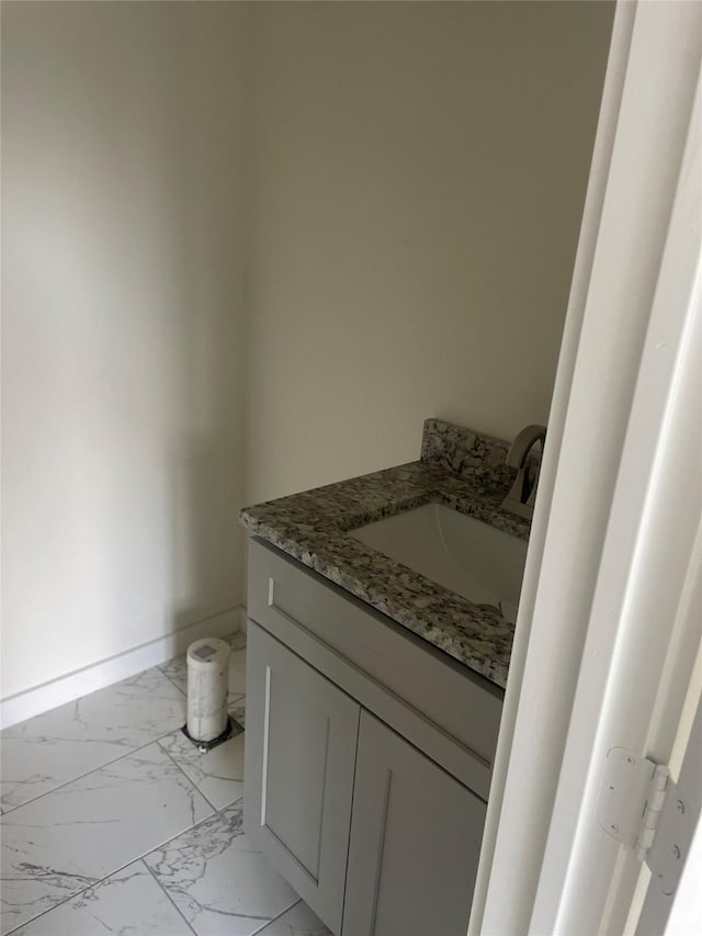 2510 Oxford Ave, Fort Worth, TX 76106 - bathroom with baseboards, marble finish floor, and vanity