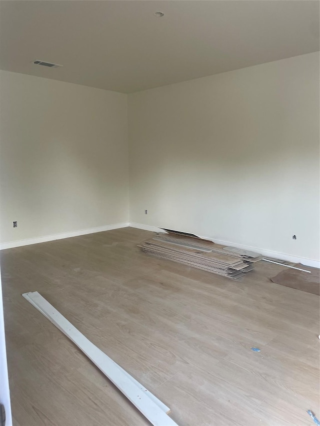 2510 Oxford Ave, Fort Worth, TX 76106 - empty room featuring baseboards, visible vents, and wood finished floors